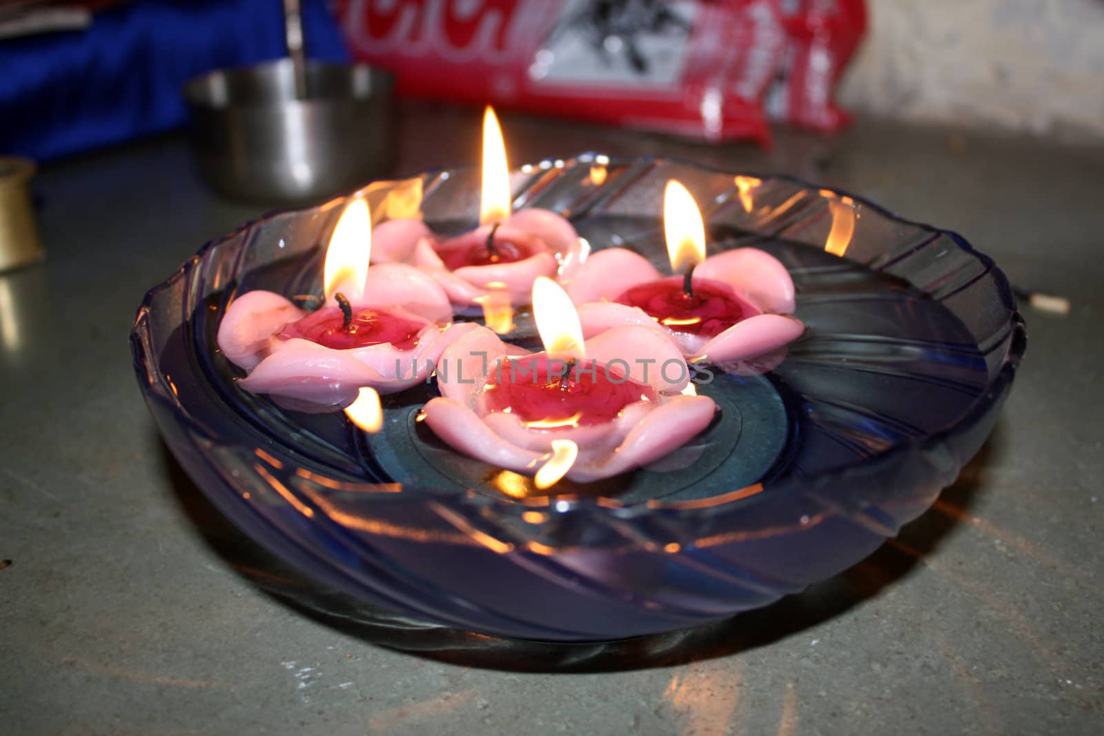 Beautiful floating candles bowl being used in a Diwali festival ritual.