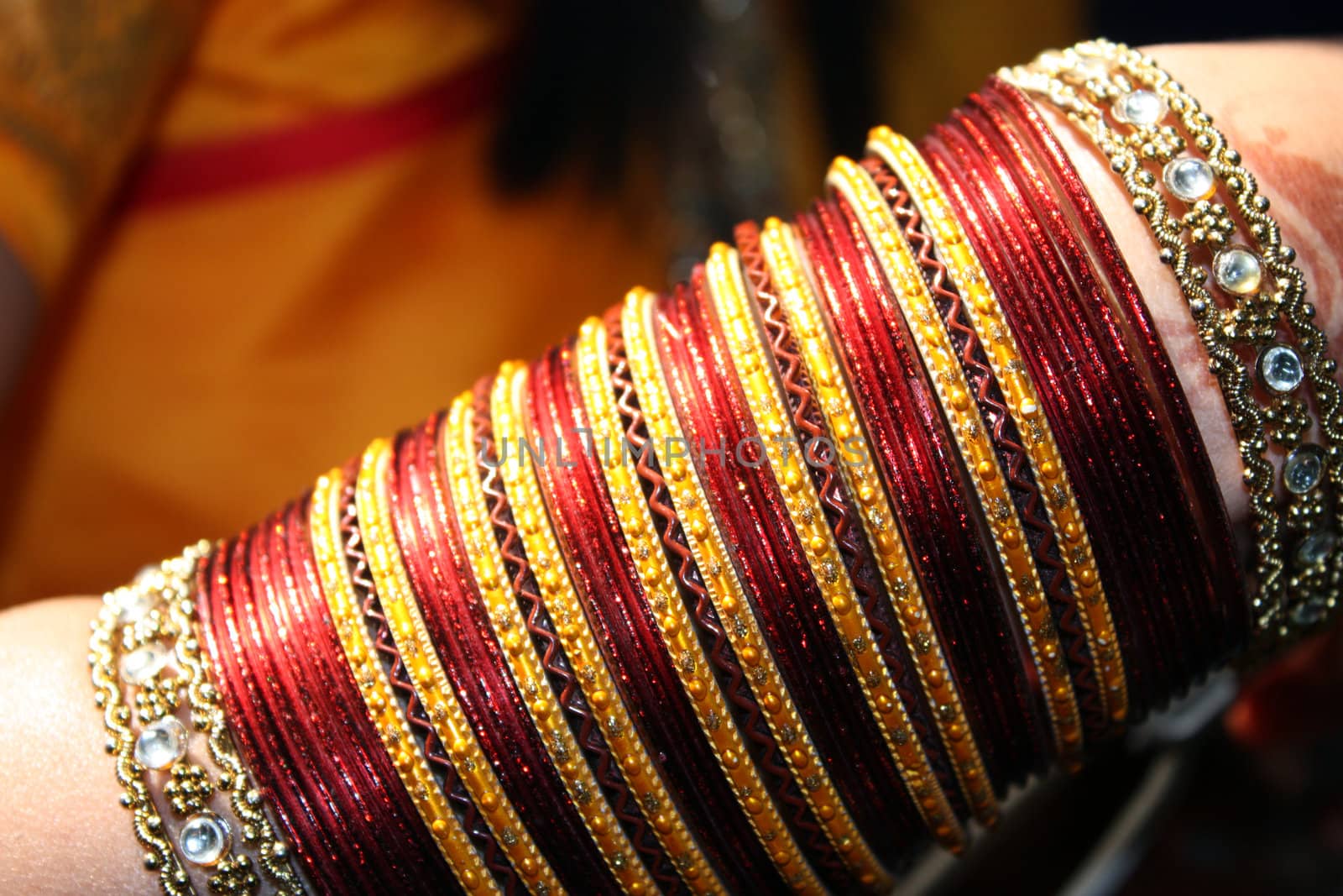 A closeup view of the traditional bangles of an Indian bride.