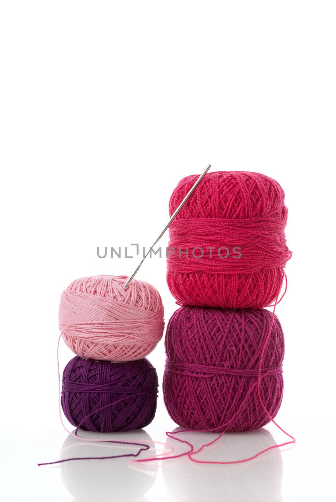 spools of many colors on a white background.