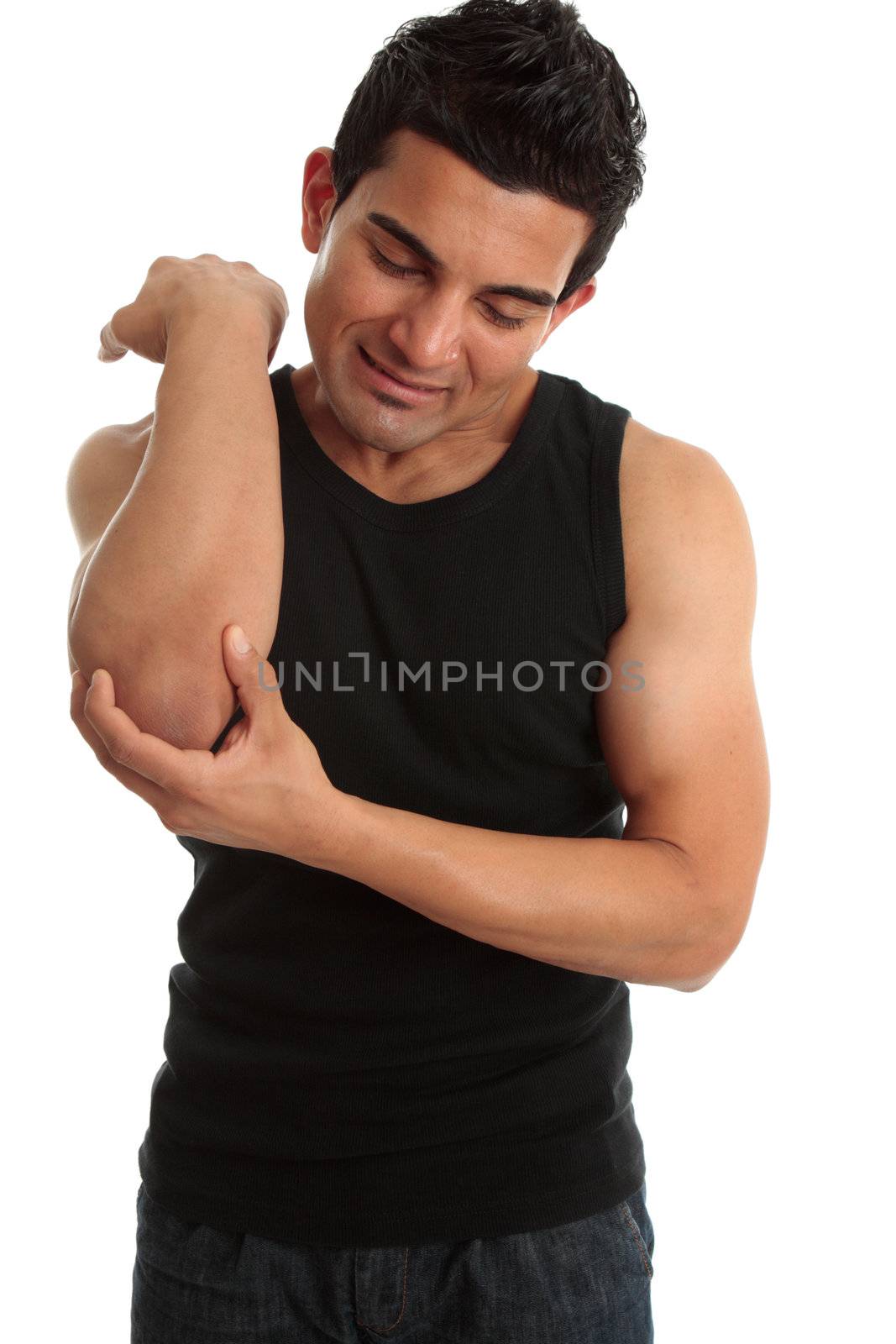A man holding his injured hurt arm and wincing in pain.  White background.