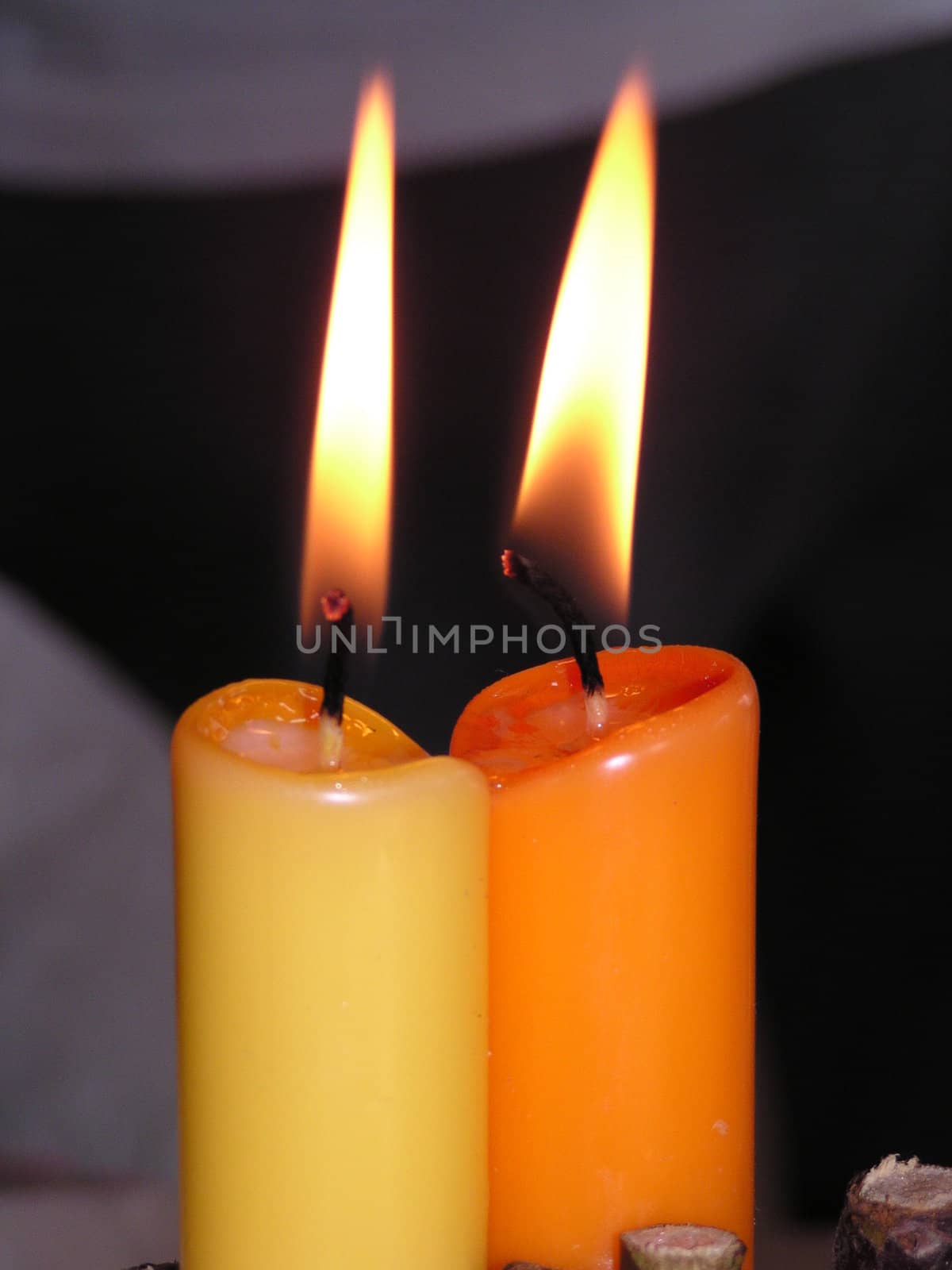 two atmospheric candles at a celebration by koep