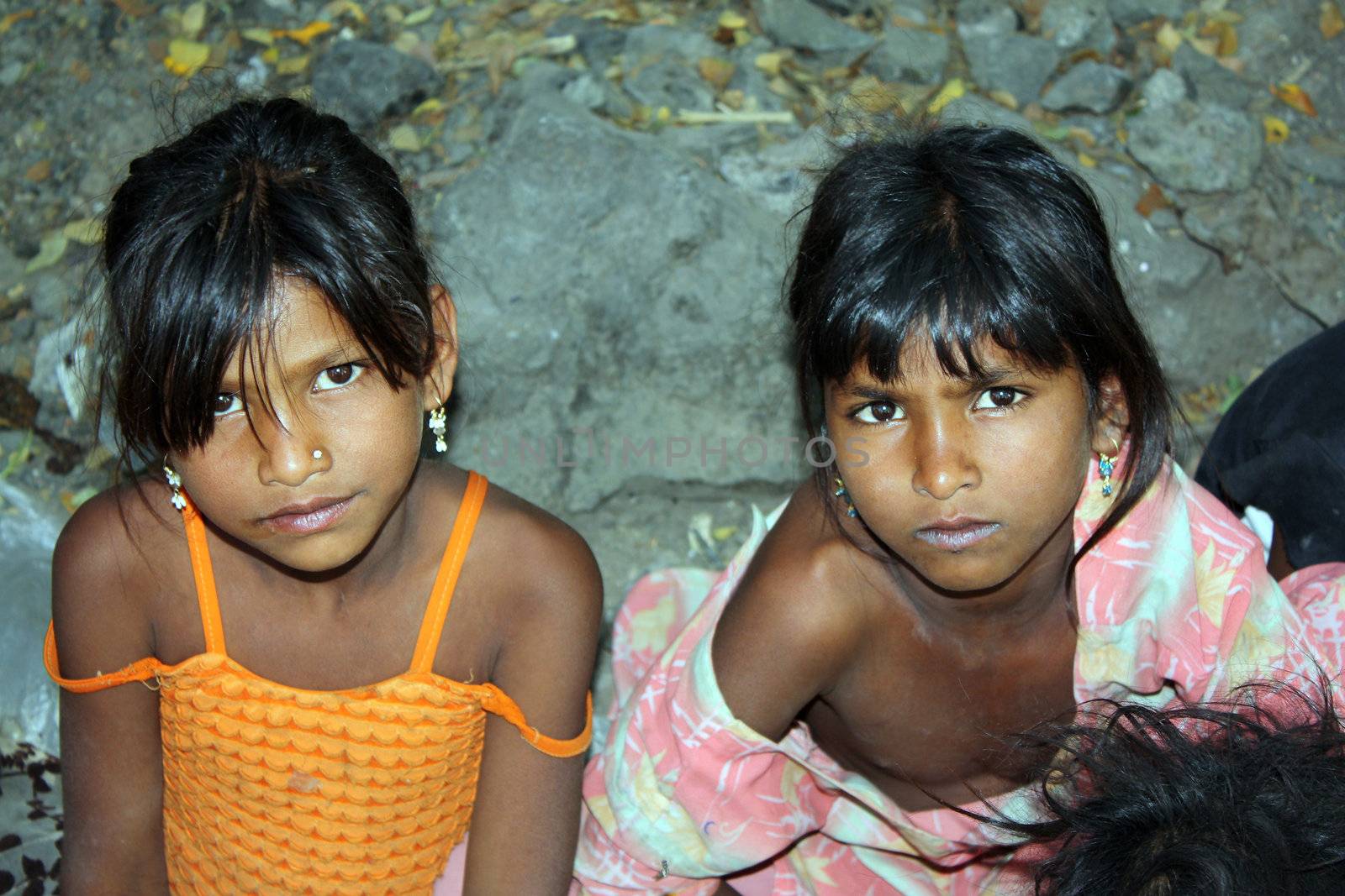 A portrait of two poor sisters from India who mostly spend their day begging on the streets.