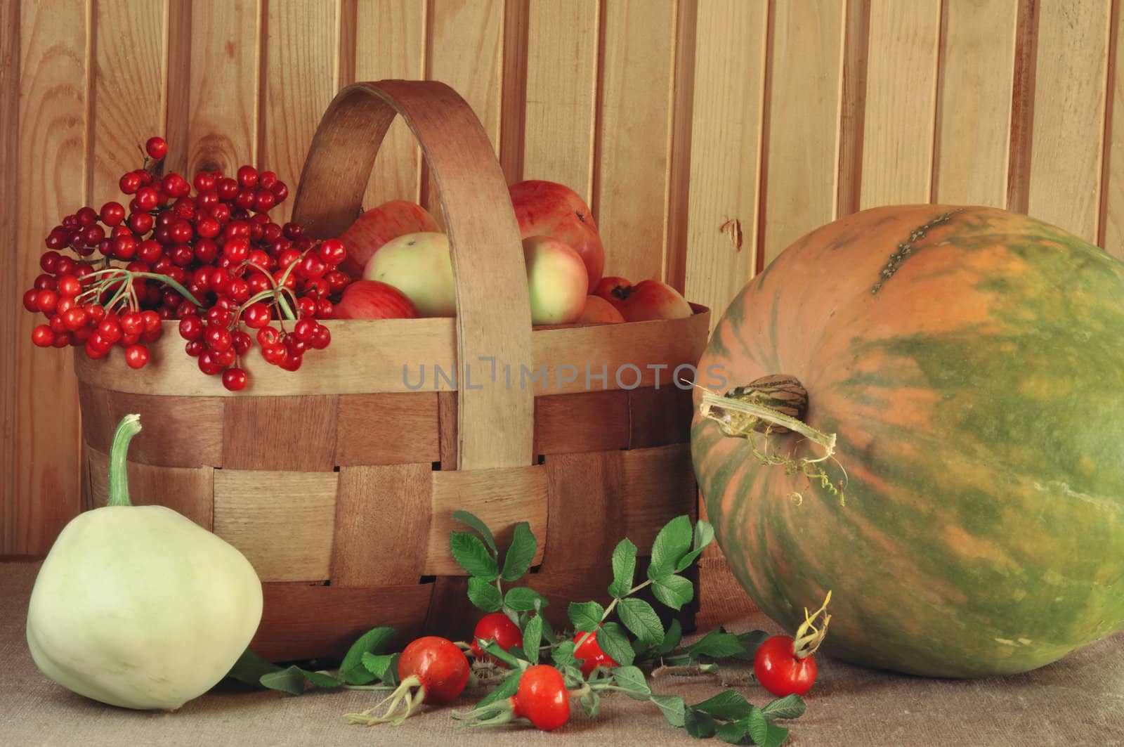Vegetables, fruit and berries in a rural wattled basket
