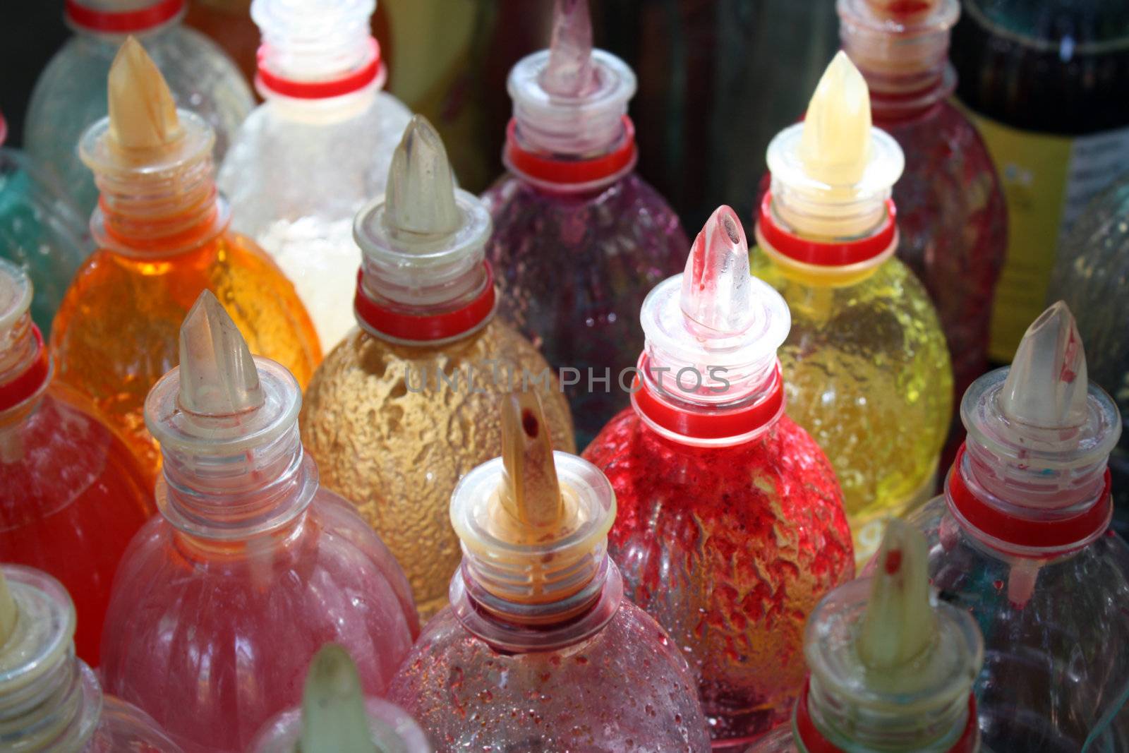 Bottles containing flavours of various fruit punches for testing.