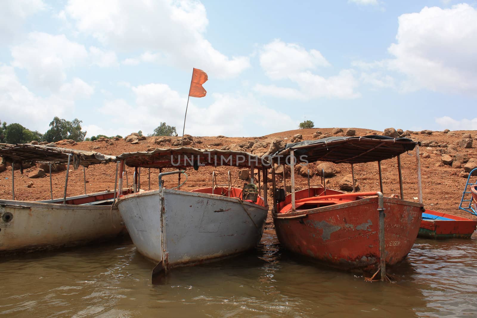 Old boats on the banks of an Indian river.