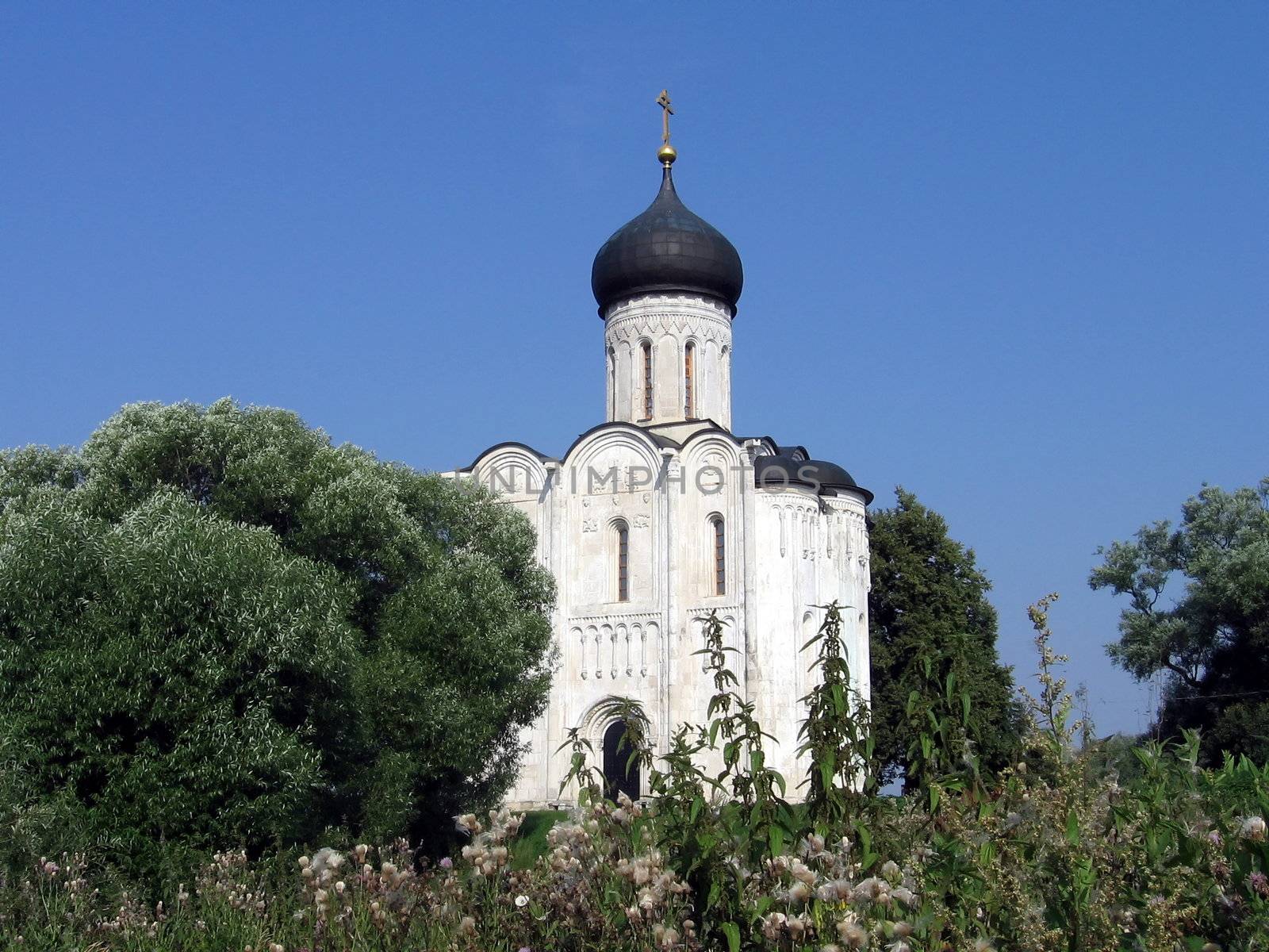 Famous church on the river Nerli on a background of blue sky