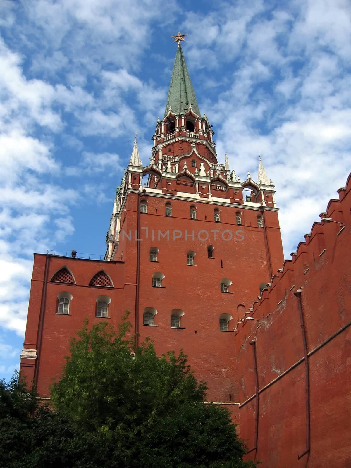 Moscow red Kremlin on a background of blue sky with clouds