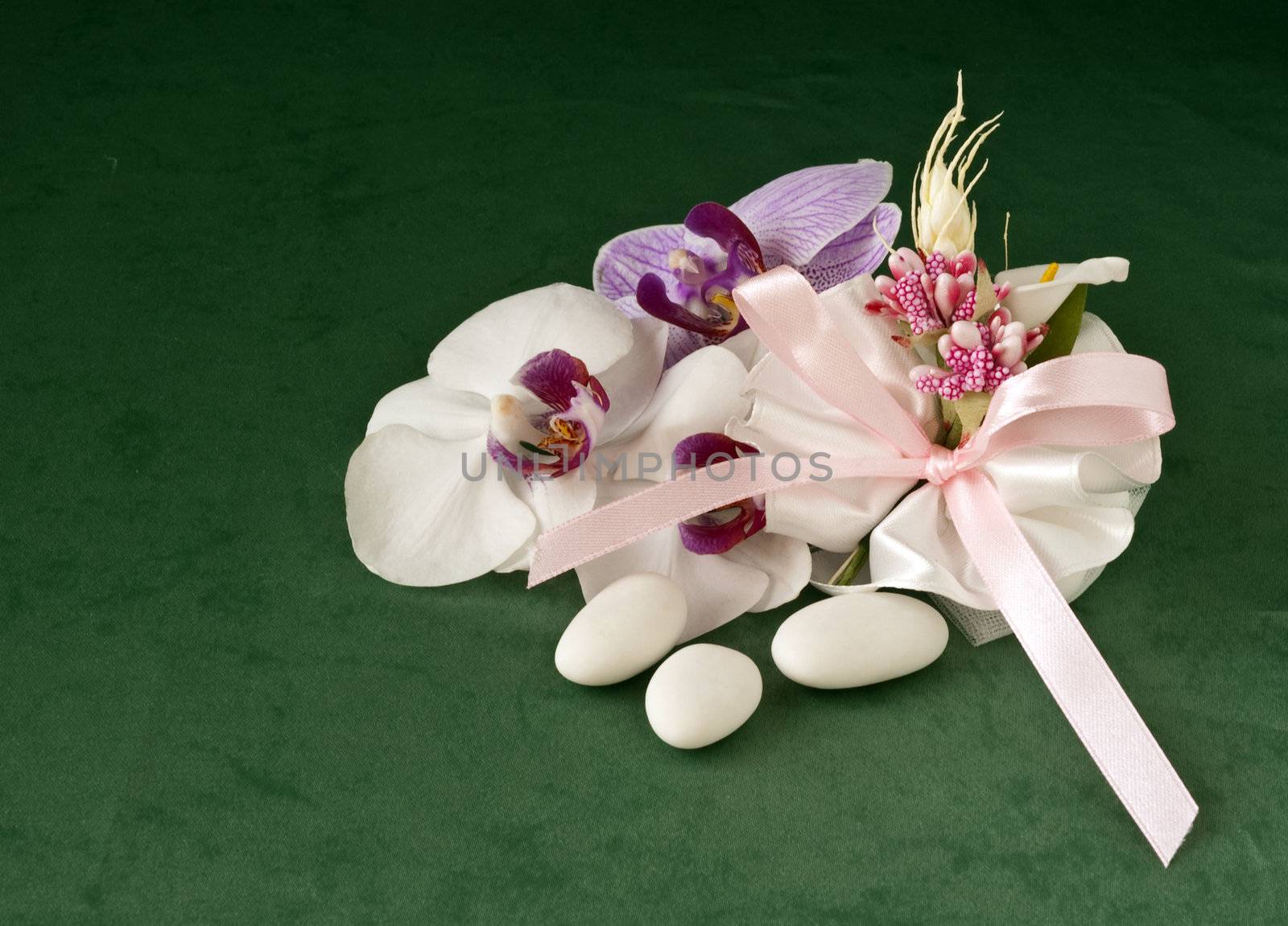 candy wedding favors and packaging materials on a green background