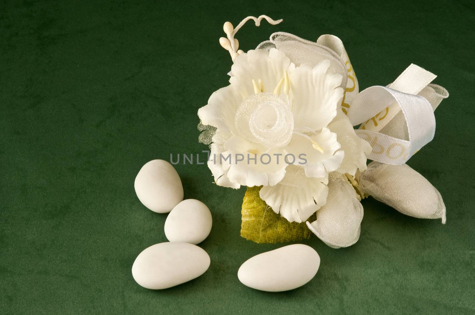 candy wedding favors and packaging materials on a green background
