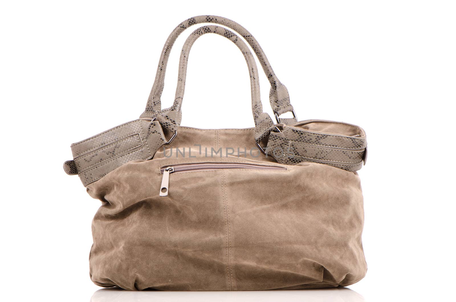 Brown woman bag on white reflective background.