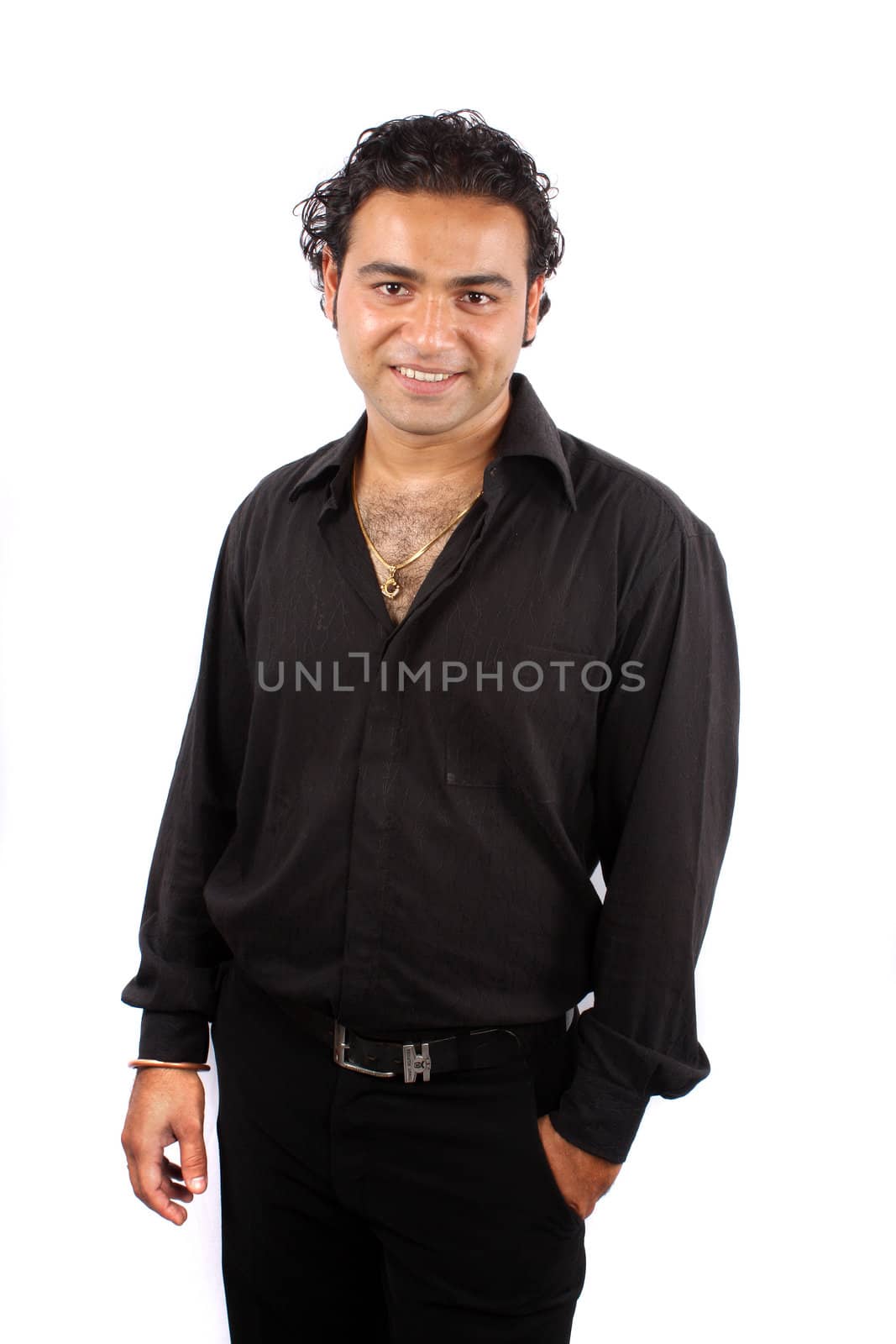 A handsome Indian guy in a black dress, on white studio background.