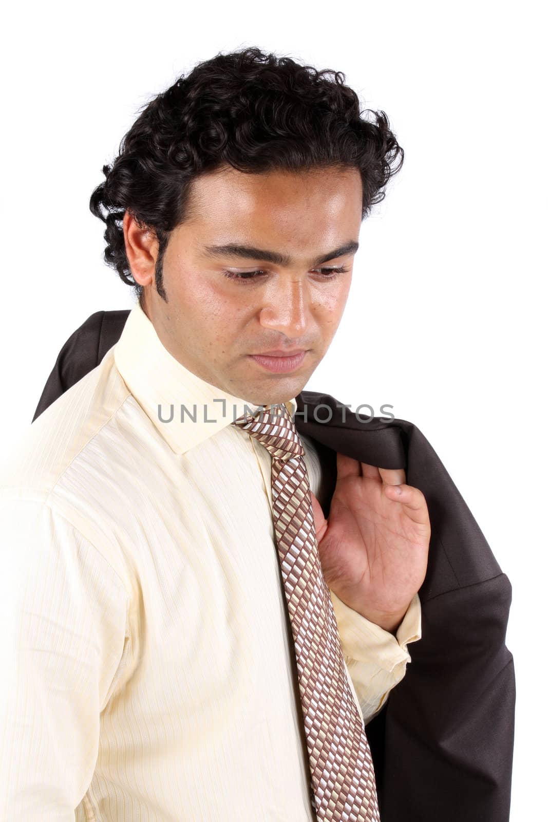 A portrait of a worried Indian businessman, on white studio background.