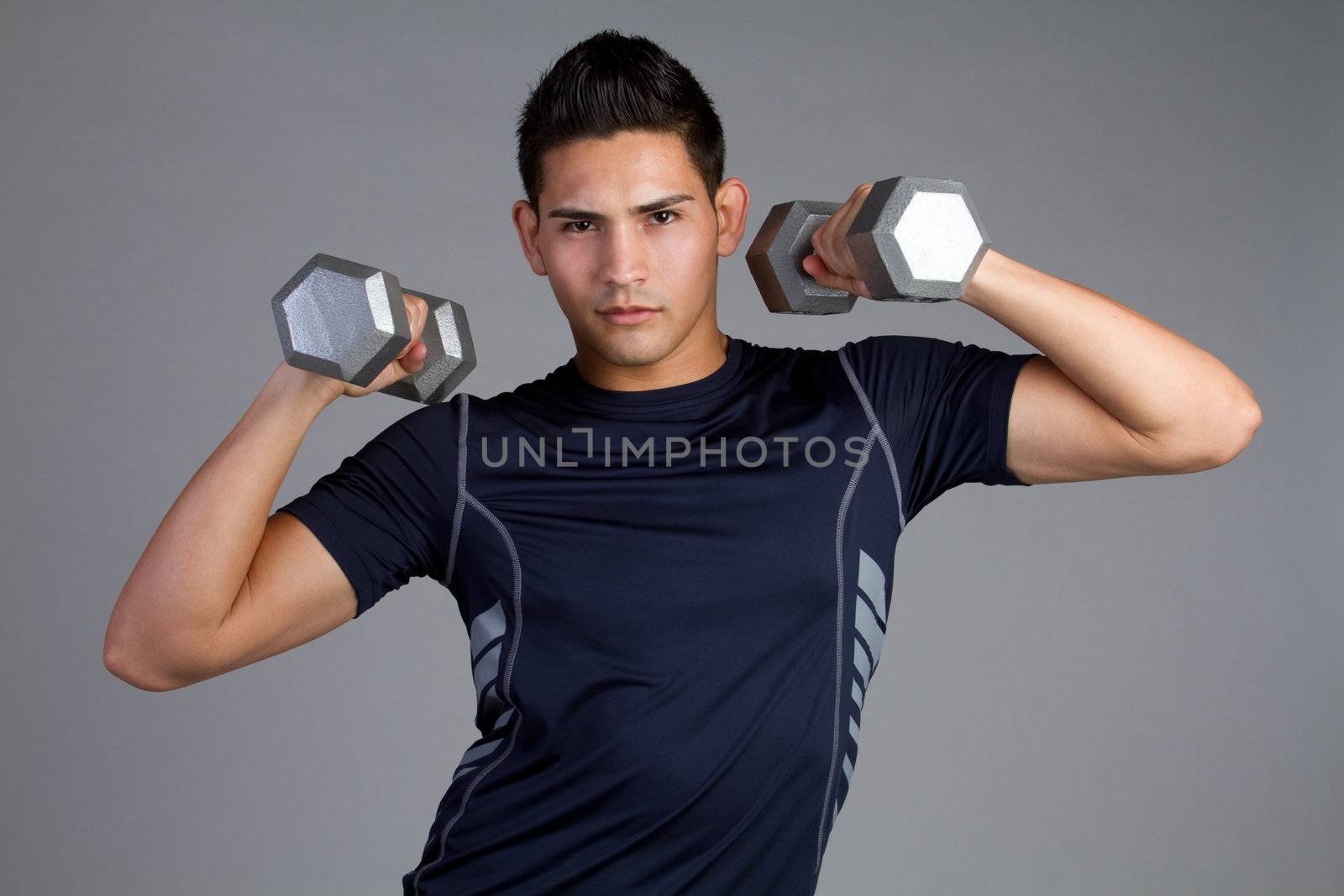 Young fit hispanic man exercising