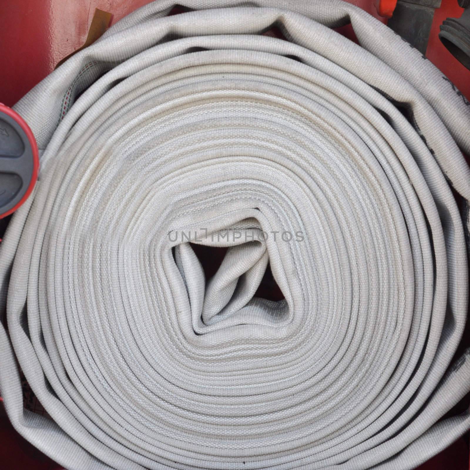 A red fire hydrant plug hose sign