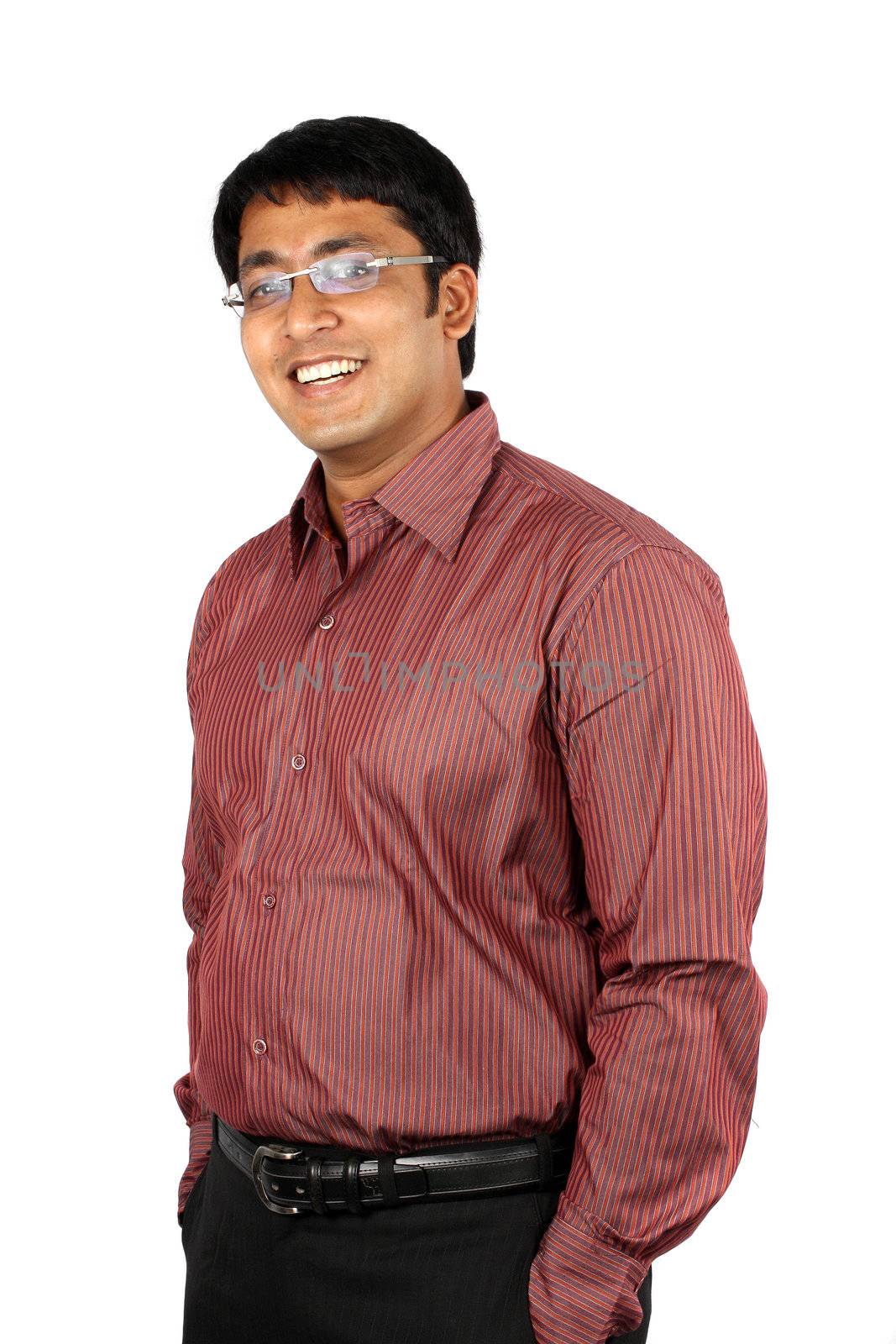 A portrait of a young Indian businessman, on white studio background.