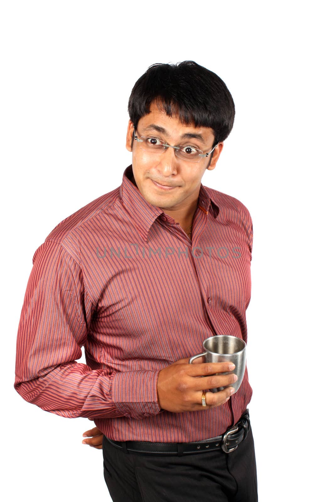 An Indian man with a coffee cup acting funny, on white studio background.