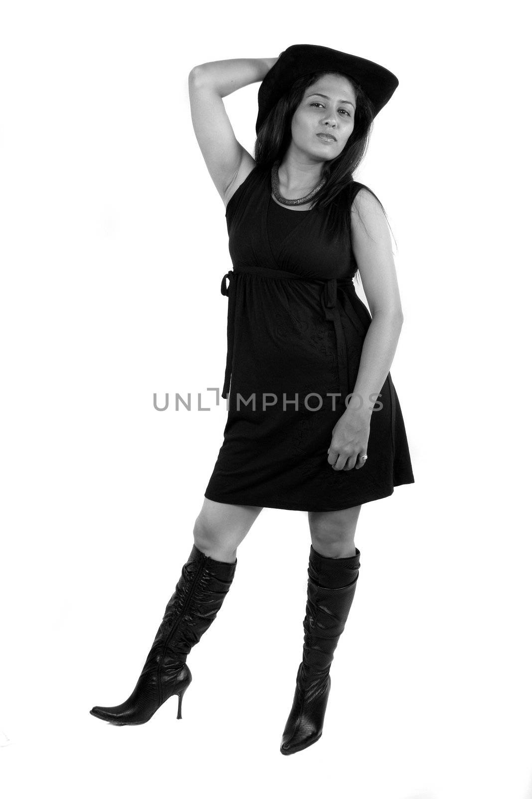 A glamorous Indian model wearing a hat, isolated on white studio background.