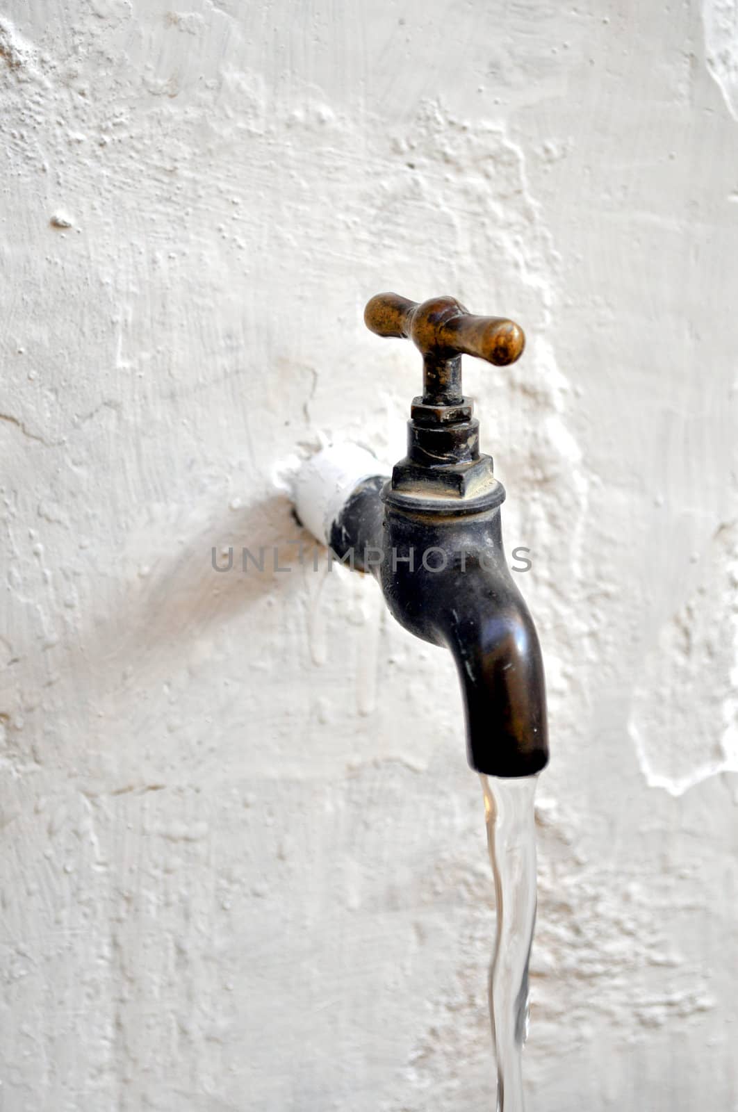 Detail of a water tap valve faucet spigot