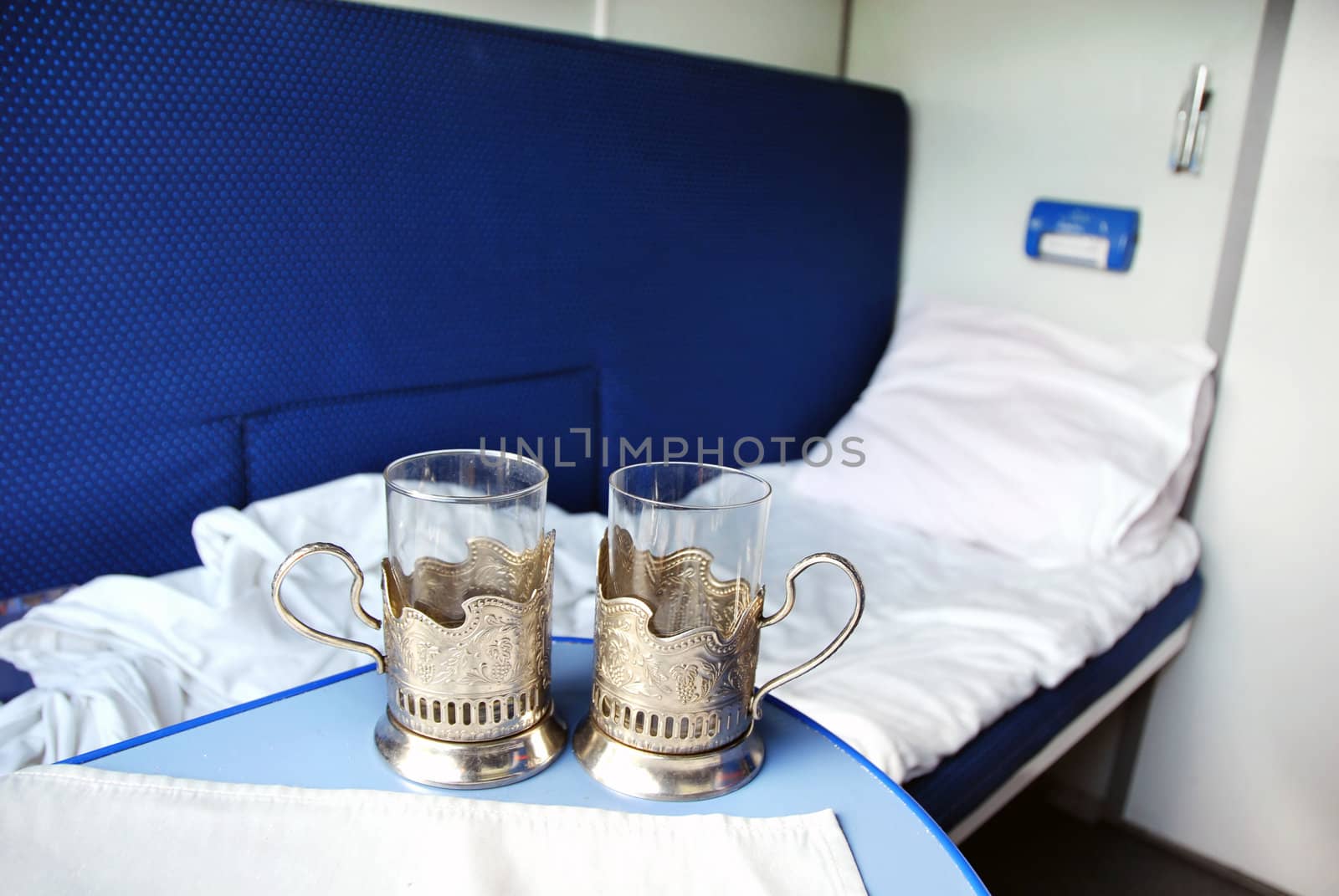 empty glasses for tea and coach in train wagon