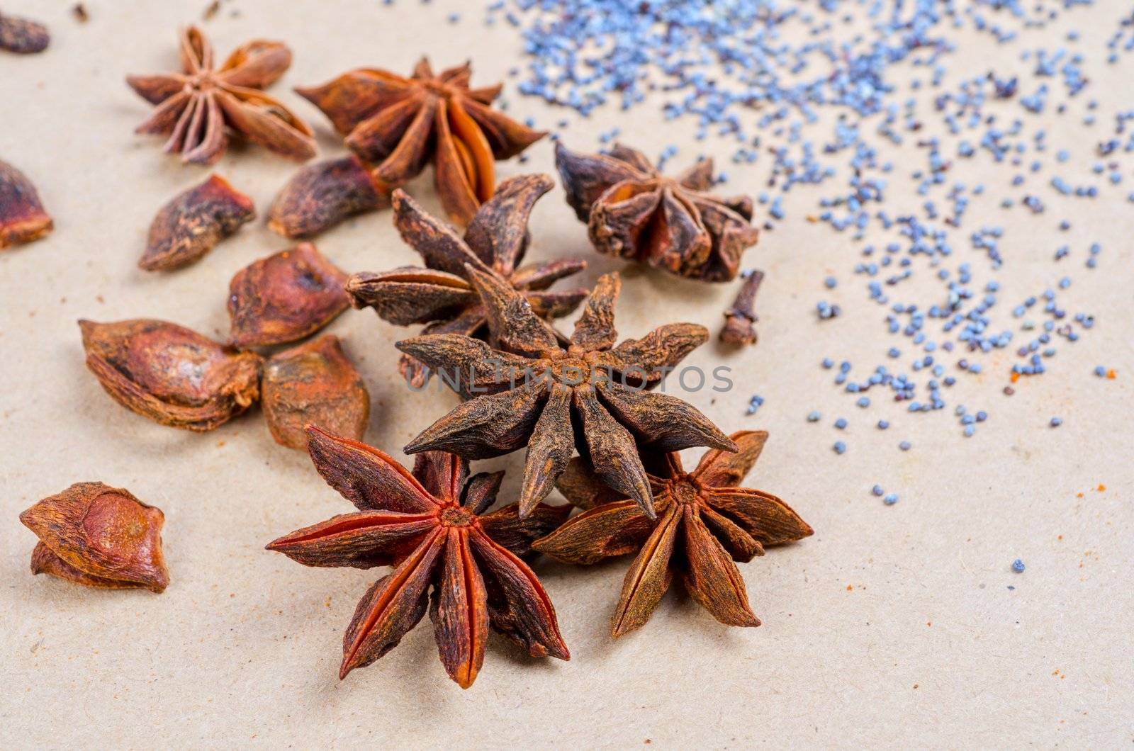 Anise stars close-up on a brown background