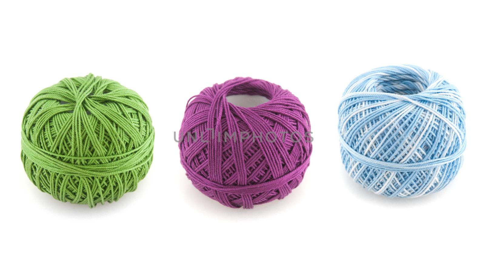 spools of many colors on a white background.