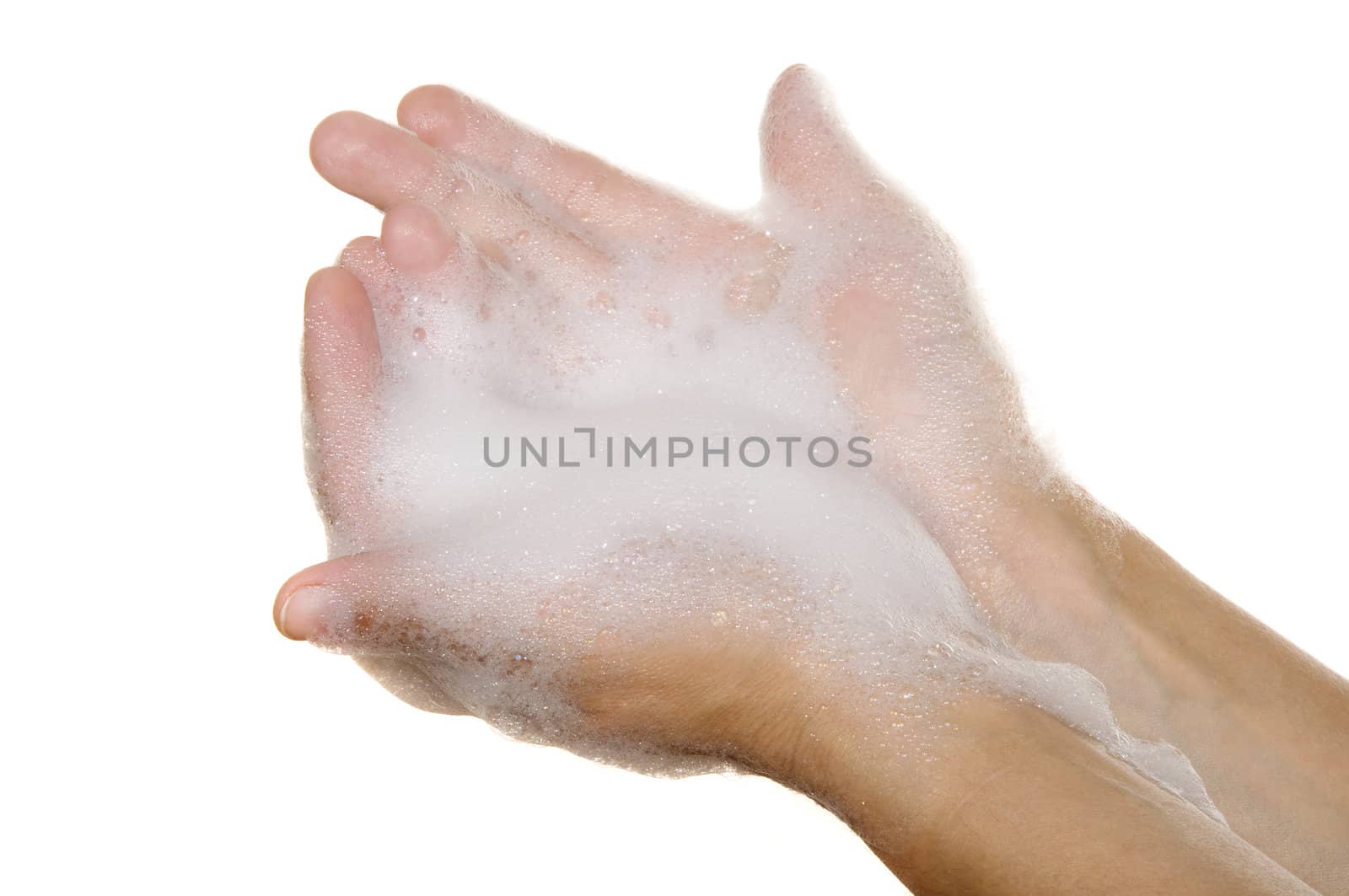 hands on a white background covered with foam
