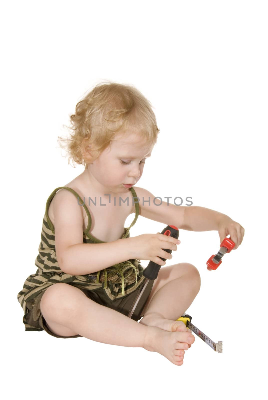 girl with a screwdriver pliers and a tape measure on a white background