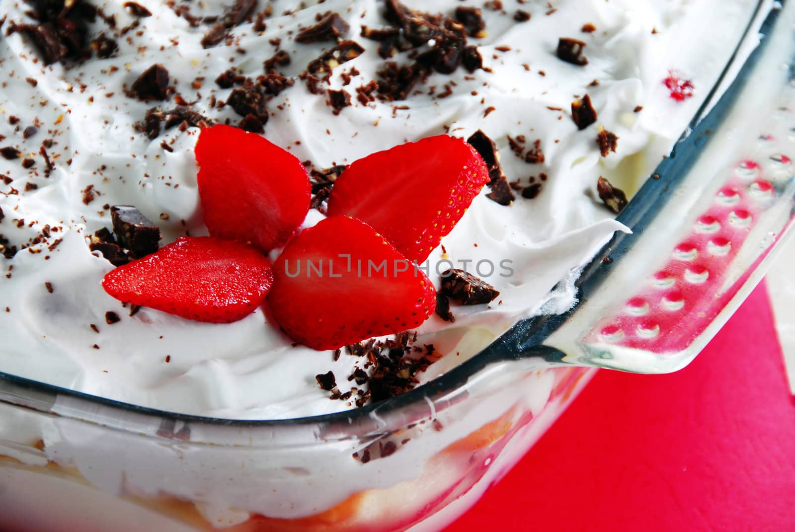 homemade cake with strawberries, whipped cream and chocolate