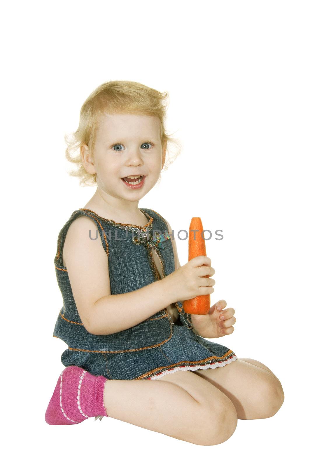 small girl with carrot on white background