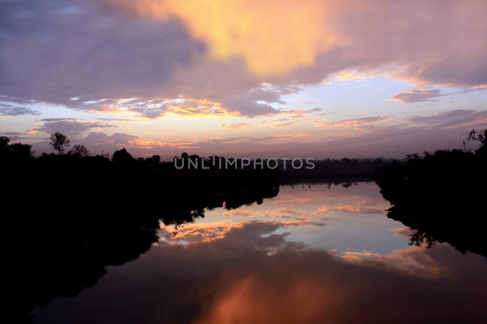 A beautiful background of the dawn light, over a river.