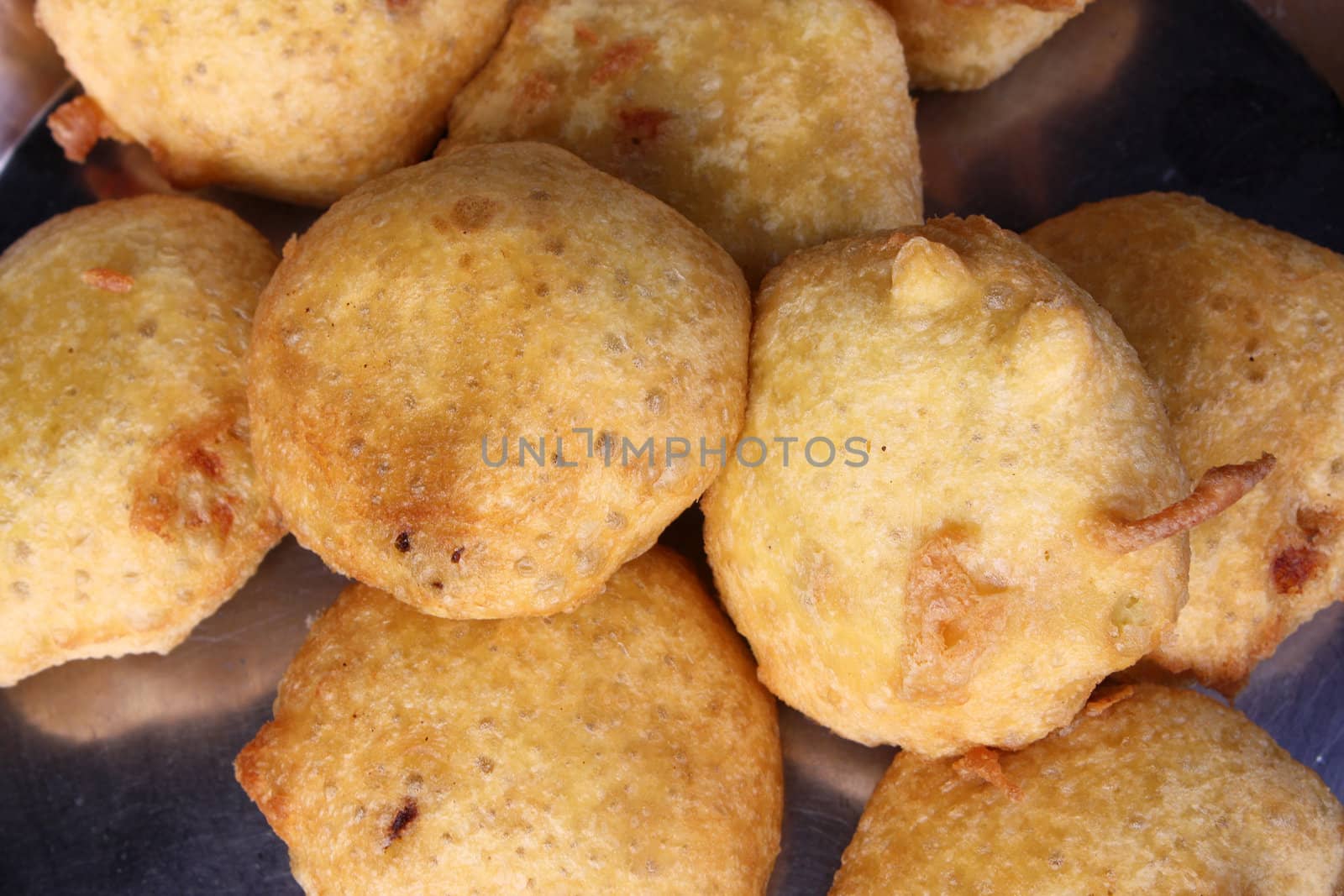 An Indian fast-food dish called as batata/aloo wada, which is like a potato burger.