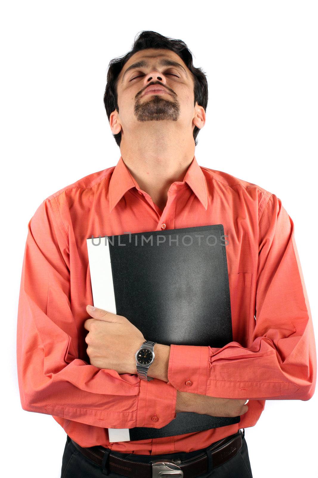 A metaphorical portrait of a young Indian guy praying before his job interview, on white studio background.