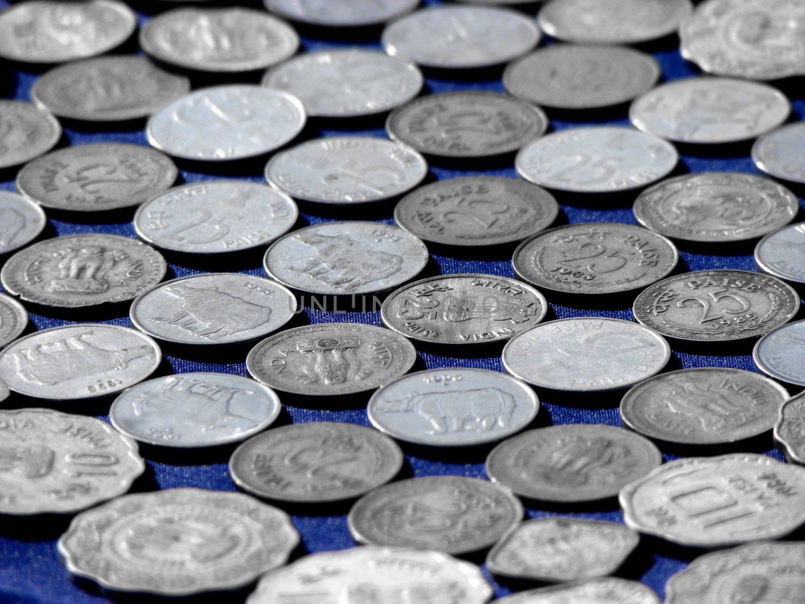 A background of very old Indian coins.