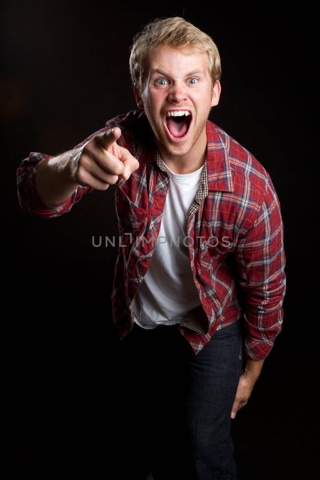 Angry yelling pointing young man