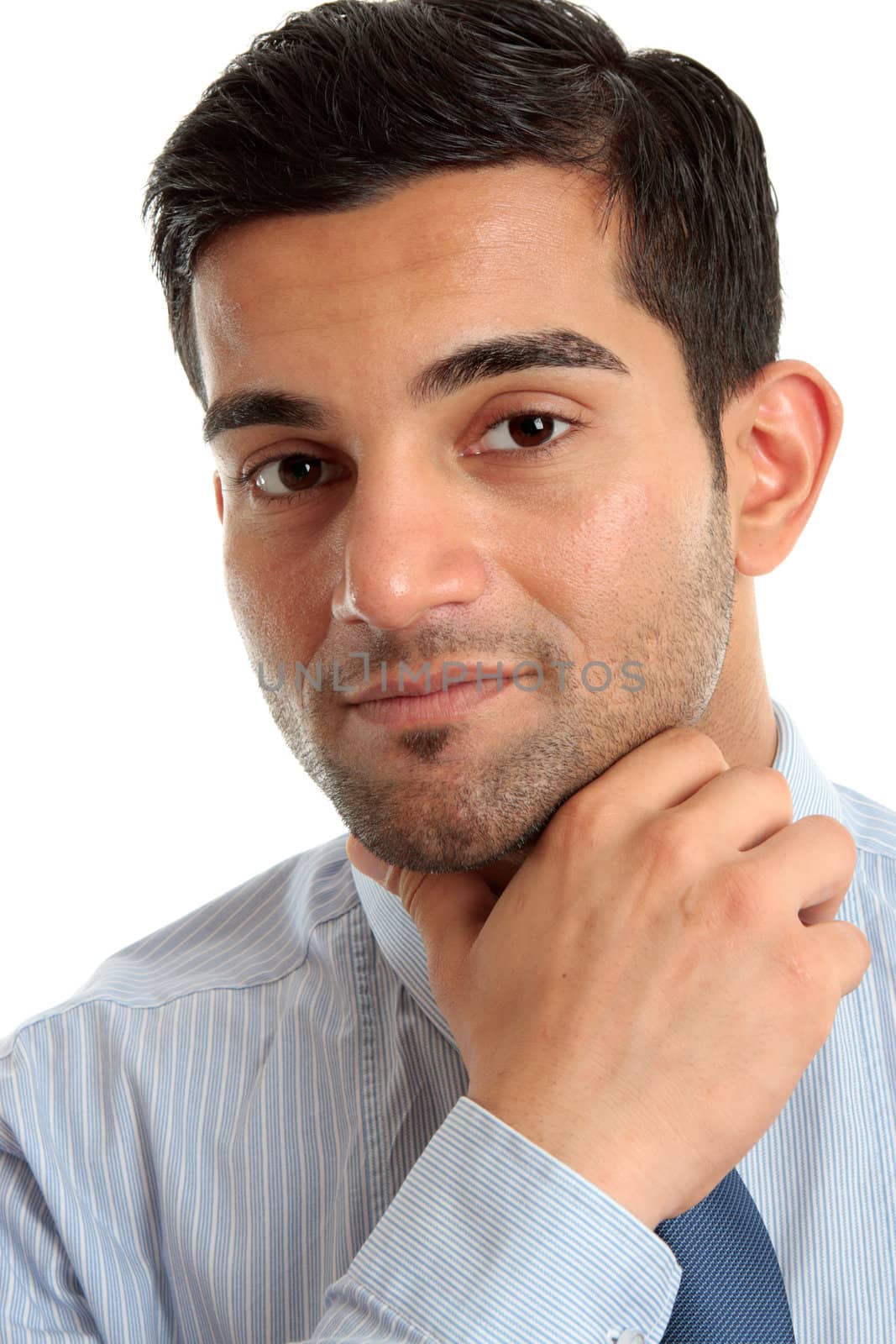 Confident businessman thinking, considering and smiling.  Closeup, white background.