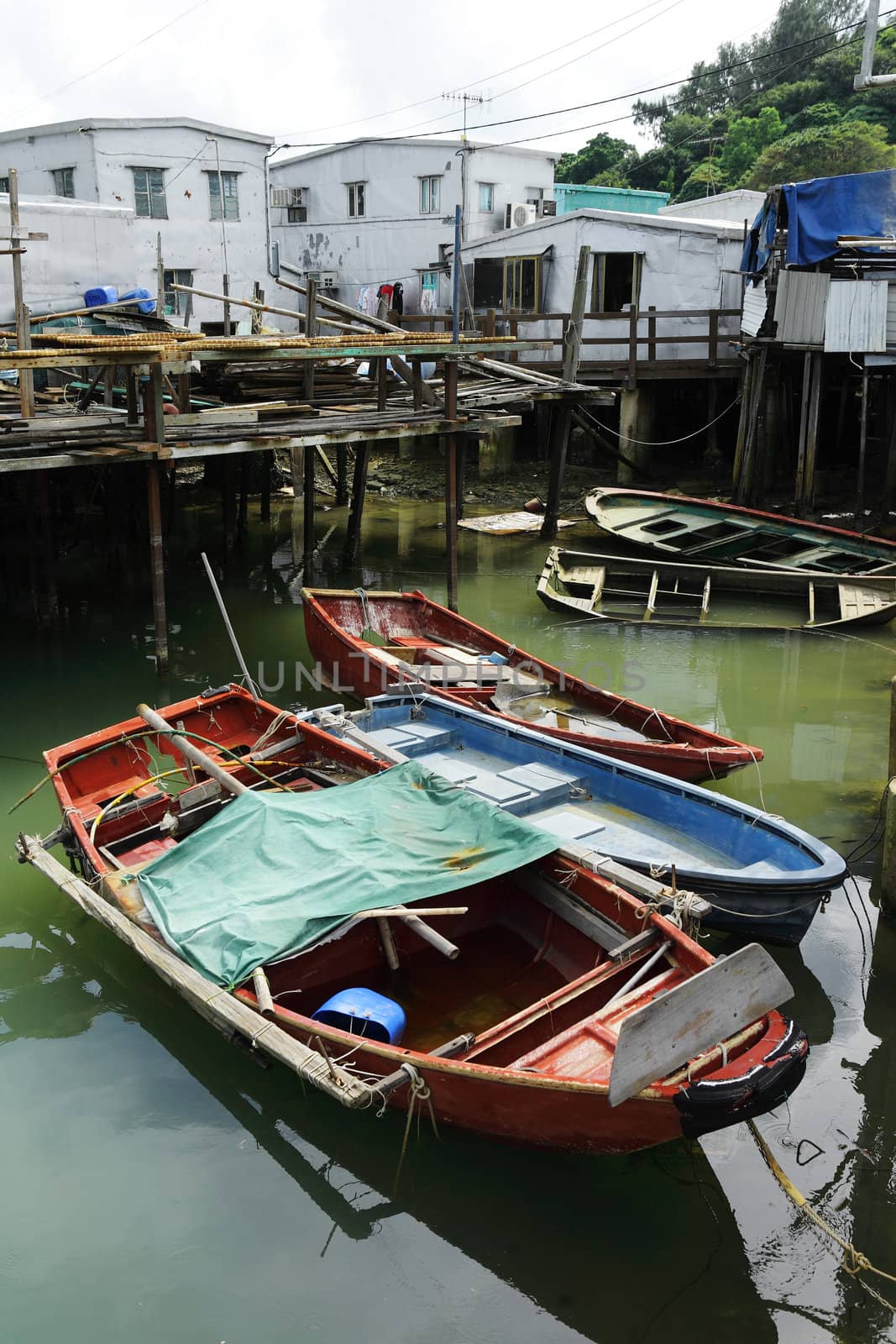 Tai O fishing village with stilt house and old boat