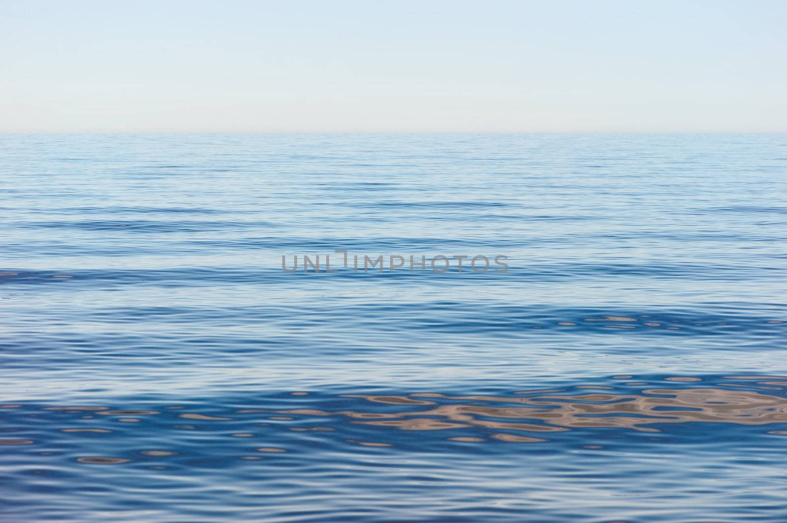 Sea surface with small soft waves in morning