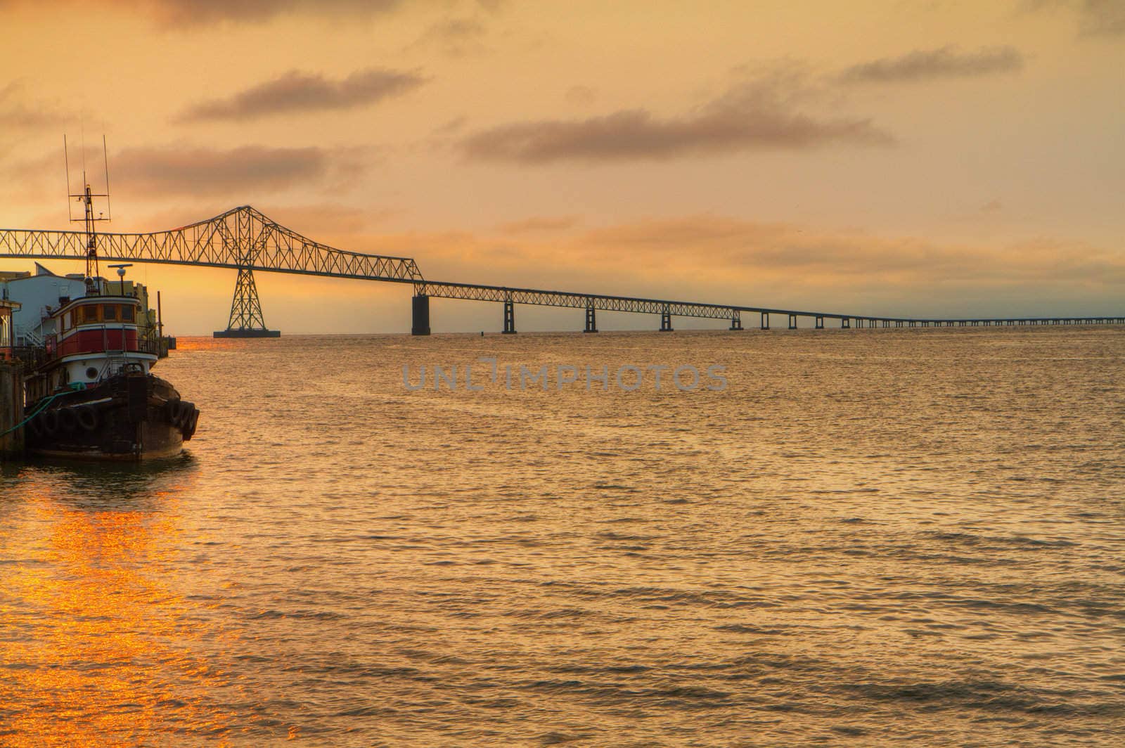 Columbia Bridge Sunset with pilot tug boat