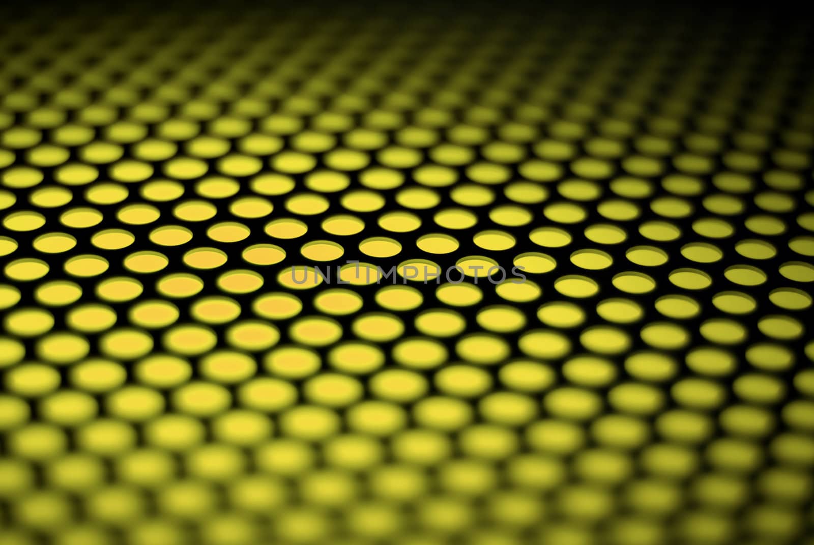 A metalic reflective surface back lit by a colorful light.