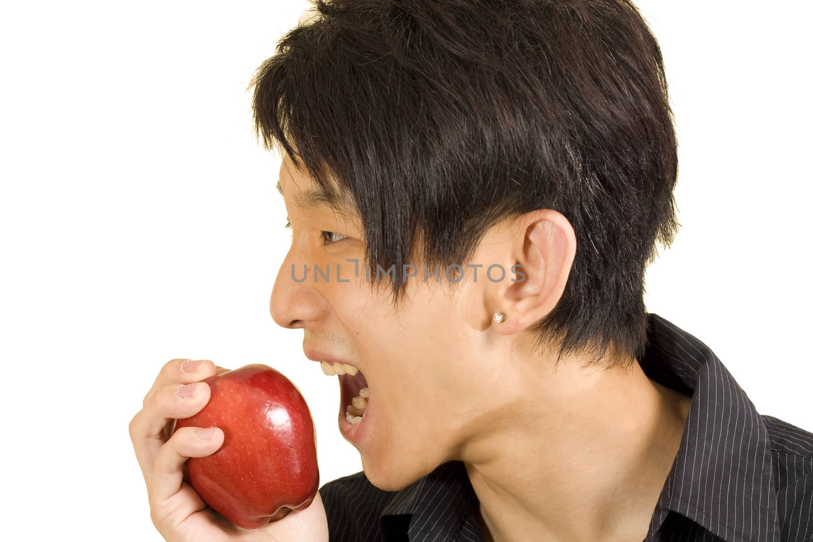Young Asian man eating apple