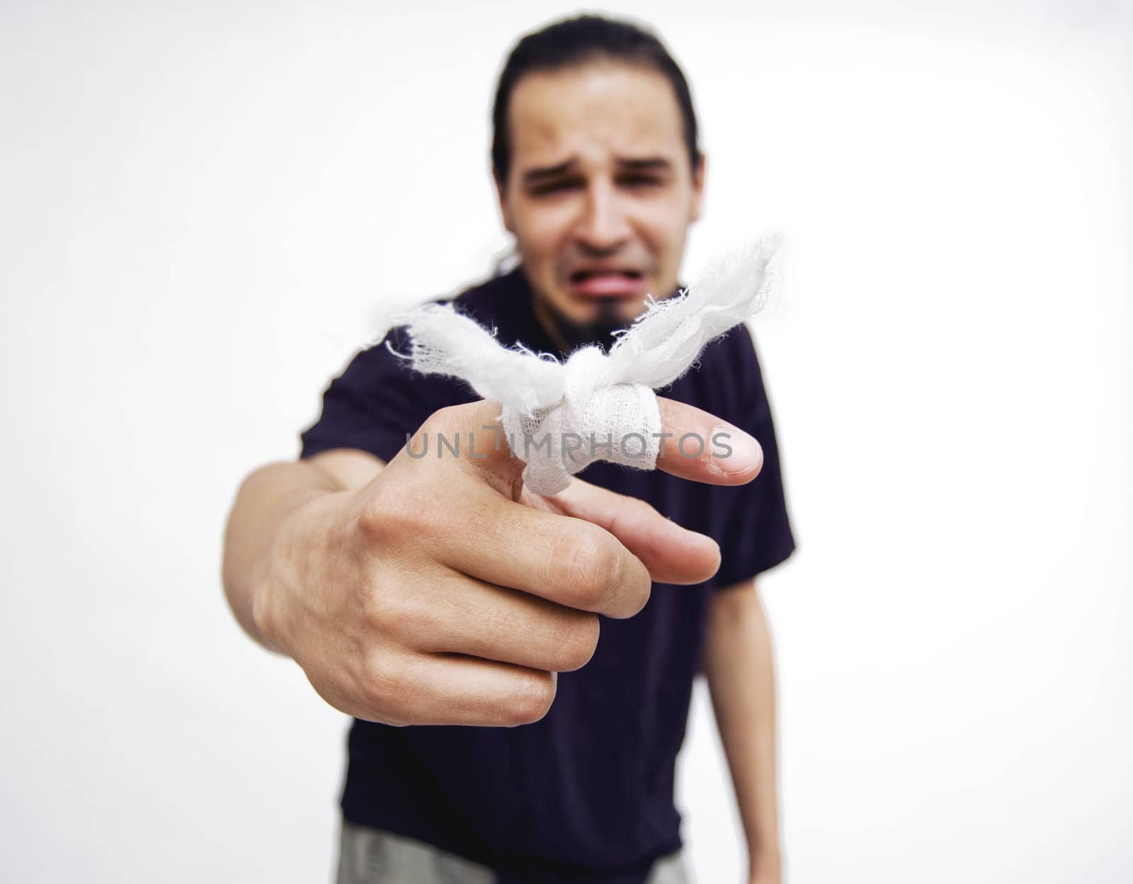 Young man with bandage on finger.