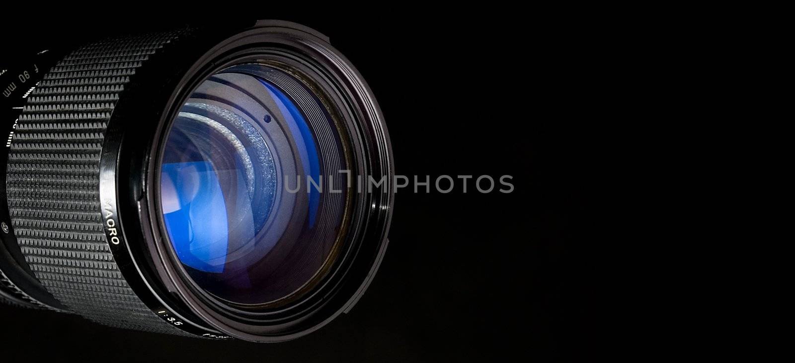 Photograpy lens over black background.