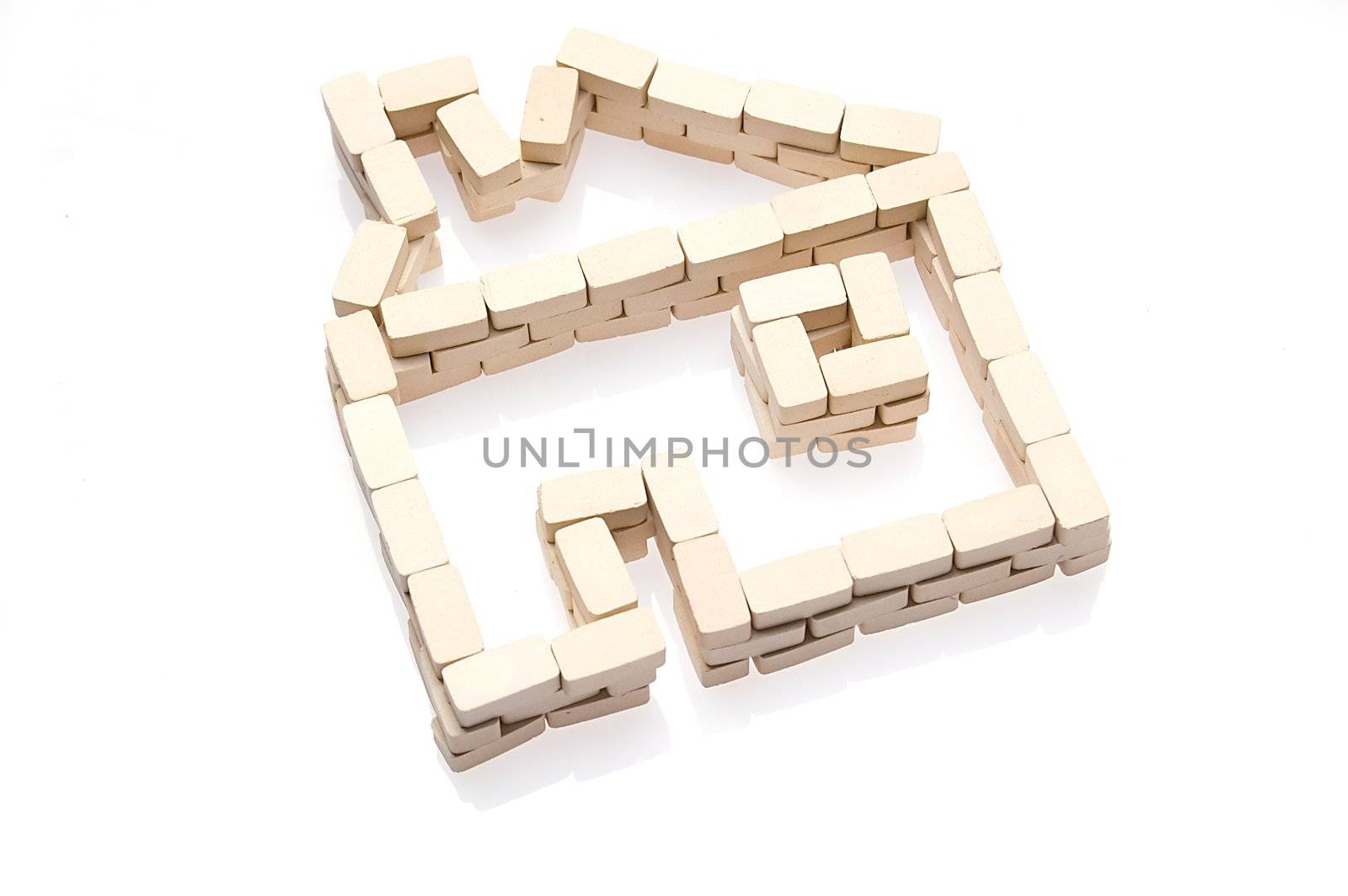 House symbol and bricks over white. Real estate icon