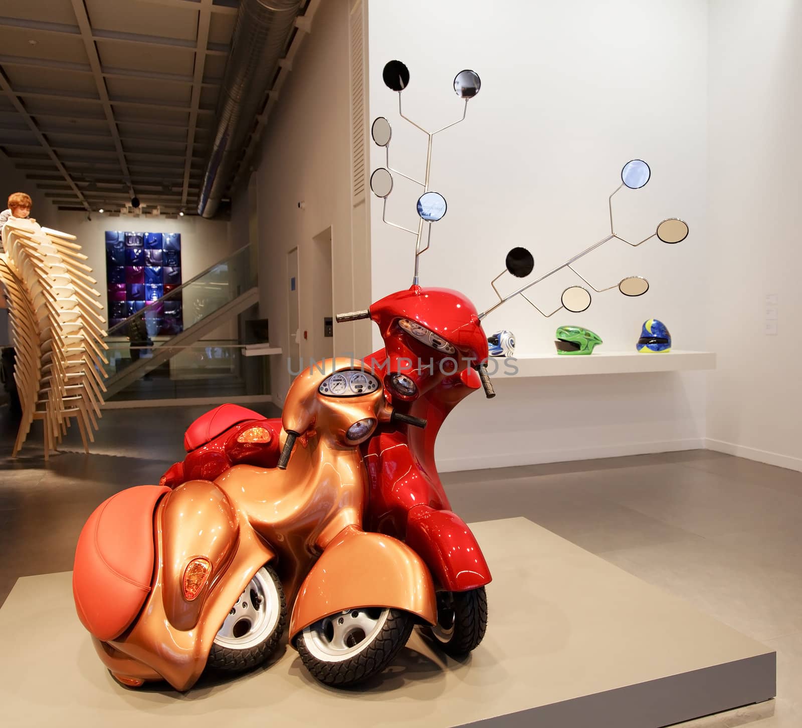Istanbul, Turkey - June, 2011: Hold me close to your heart exhibition by Patricia Piccinini Arter Gallery. Helmets, Boy climbing Chairs and Lovers