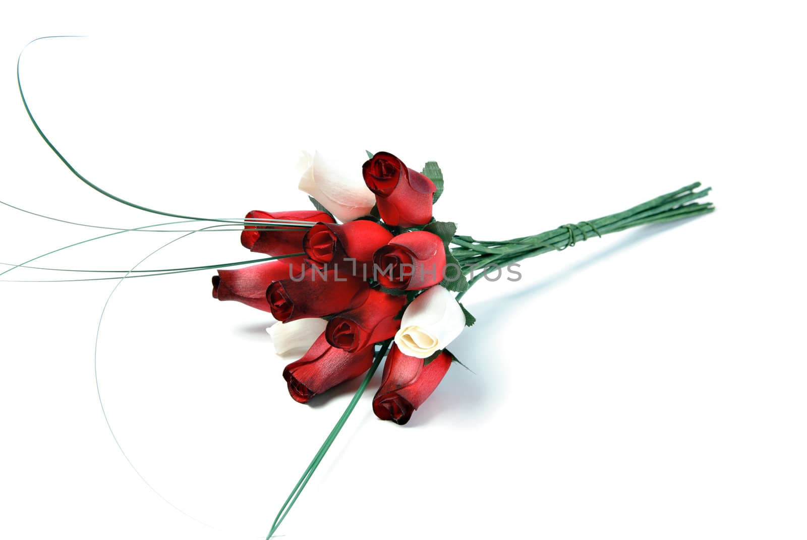 A bouquet of a dozen roses that are made of wood, isolated on a white background.