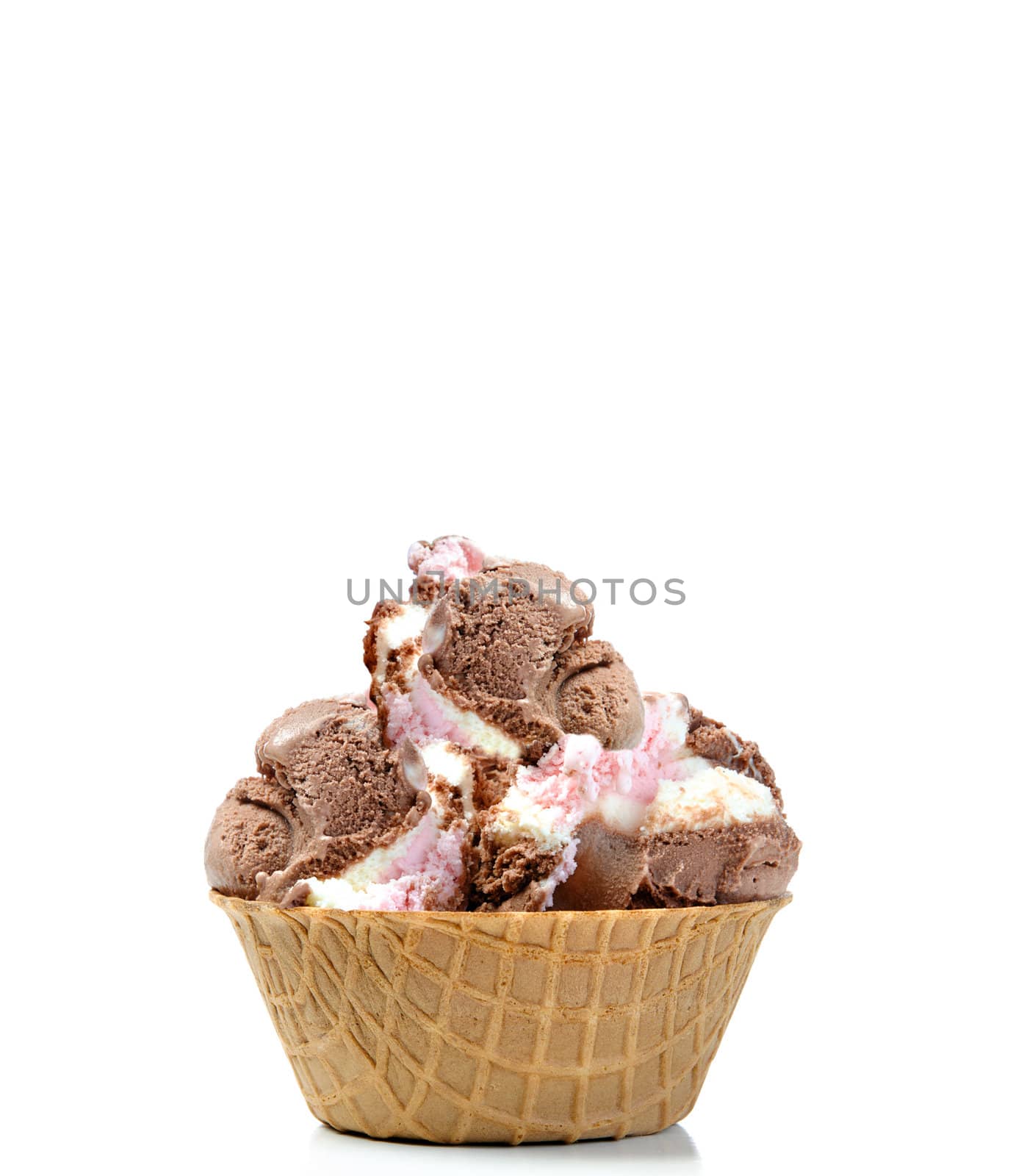 Chocolate and Vanilla icecream pile high in a wafer bowl, isolated against a white background with additional space on top for text.
