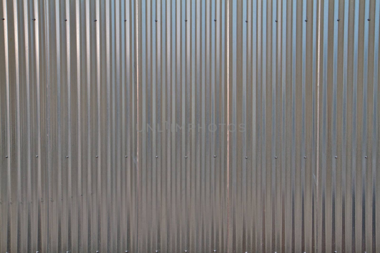 Close up of a shiny corregated steel wall