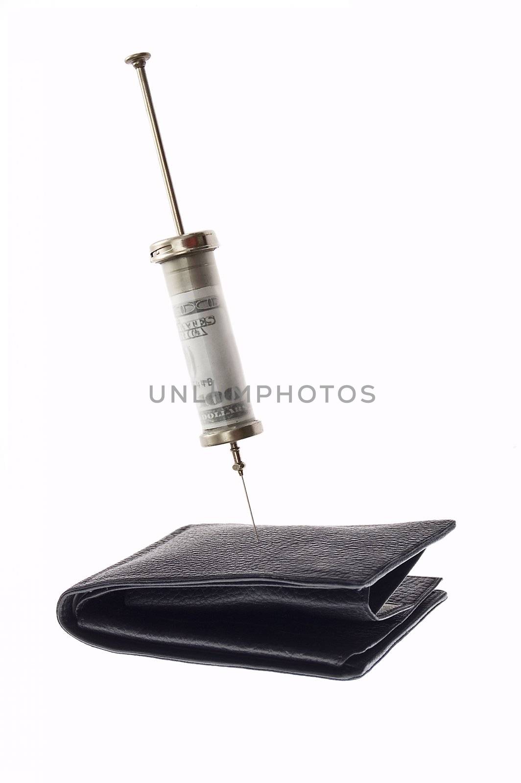 Cash injection or medical costs concept -  syringe with money inside