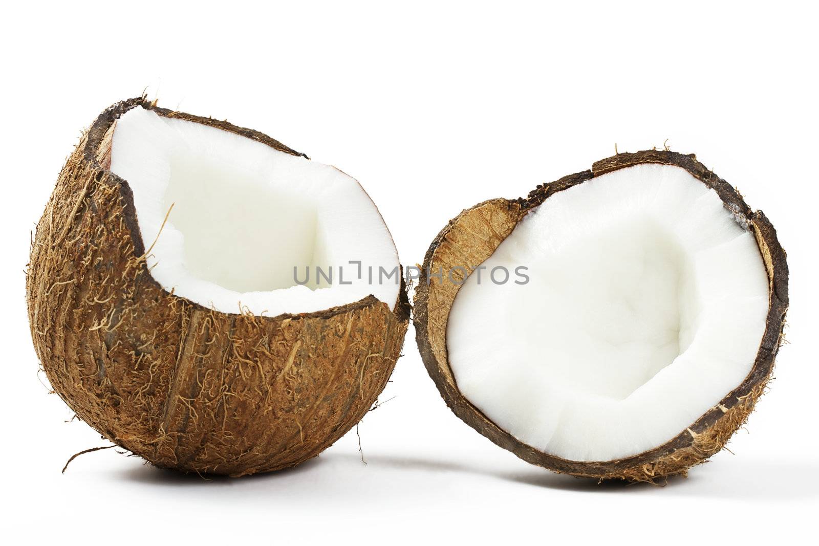 one cracked coconut on white background