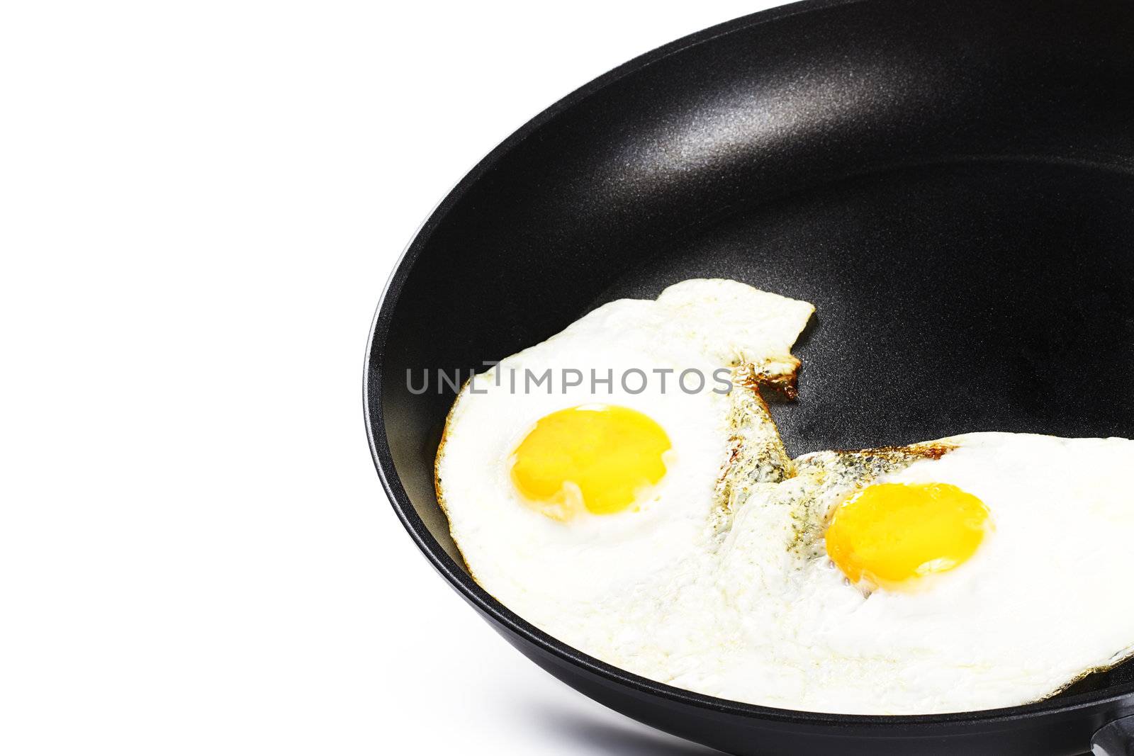 fried eggs in a pan by RobStark